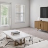 a living room with a tv and couches