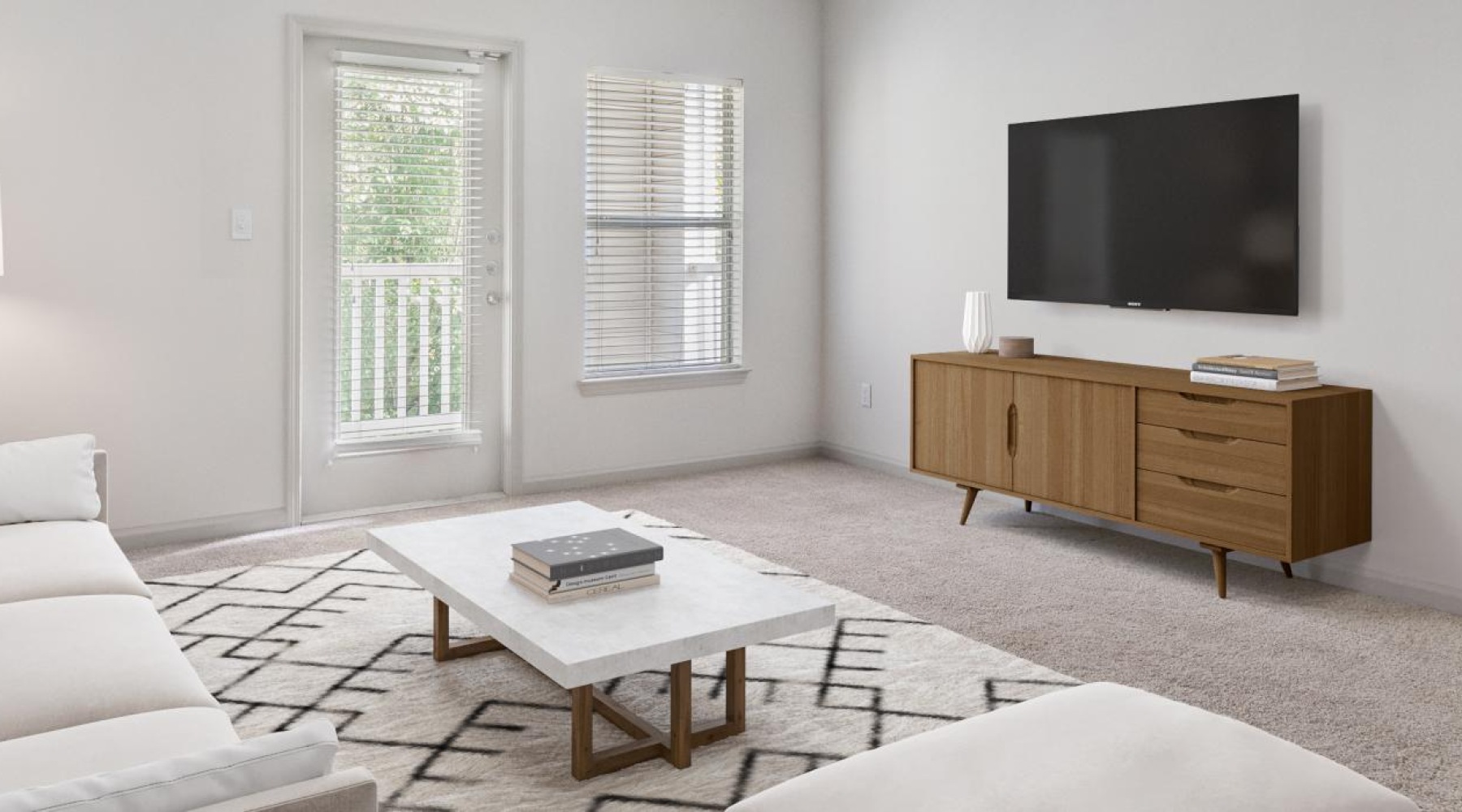 a living room with a tv and couches